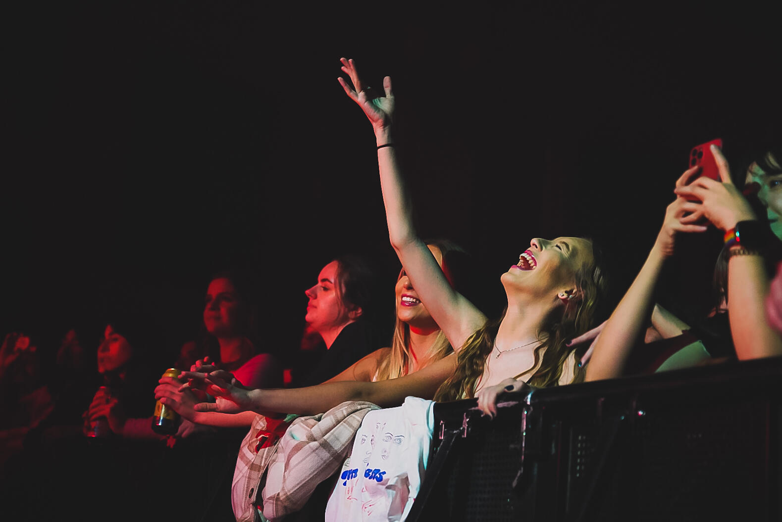 Colour image of fans dancing on the floor / pit