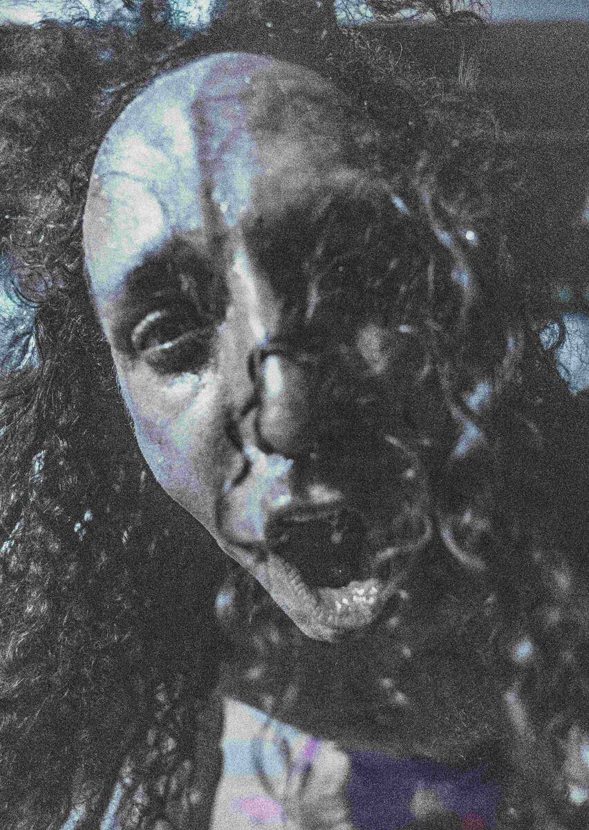 Close up colour photo of fan cheering in camera