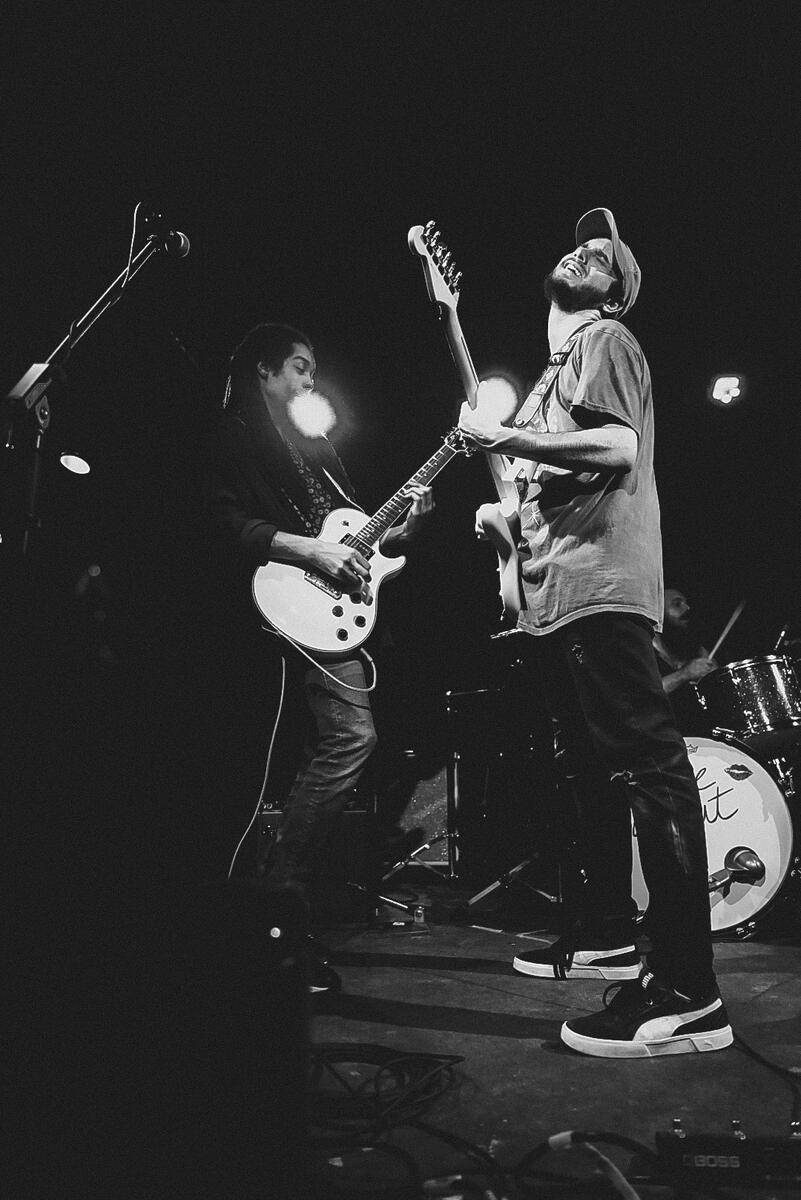 Black and white image of lead and rhythm guitarist playing together. Band is "El Paladin"