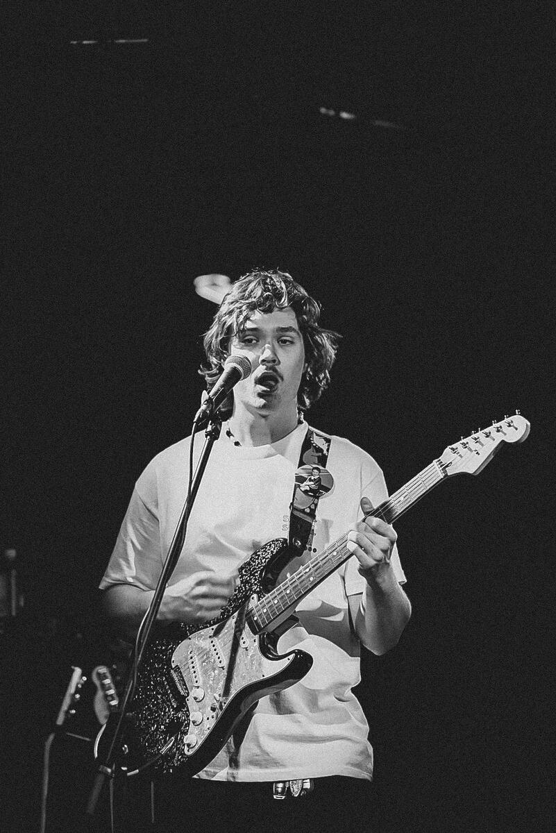 Black and white image of guitarist with mouth open. Band is &quot;Gone Out&quot;